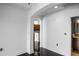 Bedroom with white walls and dark hardwood floors, adjacent to the kitchen and bathroom at 3445 Stratford Ne Rd # 1101, Atlanta, GA 30326