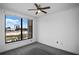 Bedroom with a window view of the city skyline, complemented by gray carpet and neutral walls at 3445 Stratford Ne Rd # 1101, Atlanta, GA 30326