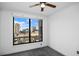 Bright bedroom with a ceiling fan and a large window with city views at 3445 Stratford Ne Rd # 1101, Atlanta, GA 30326