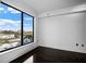 Bedroom with hardwood floors, large window, and natural light at 3445 Stratford Ne Rd # 1101, Atlanta, GA 30326