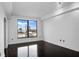 Bright bedroom featuring hardwood floors and a large window with city views at 3445 Stratford Ne Rd # 1101, Atlanta, GA 30326