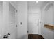 Hallway featuring hardwood floors, arched doorways, storage closet, and entry door at 3445 Stratford Ne Rd # 1101, Atlanta, GA 30326