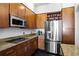 Kitchen featuring granite countertops, stainless steel appliances, and custom cabinets at 3445 Stratford Ne Rd # 1101, Atlanta, GA 30326