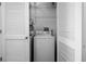Laundry closet with a washing machine, dryer and storage shelves at 3445 Stratford Ne Rd # 1101, Atlanta, GA 30326