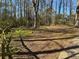 Spacious backyard surrounded by mature trees at 6625 Paula Ct, Lithonia, GA 30038