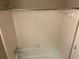 Full bathroom showcases tiled shower/tub combo with modern fixtures and white tile surround at 6625 Paula Ct, Lithonia, GA 30038