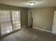 Serene bedroom with plush carpet, natural light from the window, and ample space at 6625 Paula Ct, Lithonia, GA 30038