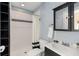 Bathroom featuring tiled walk-in shower, modern sink, cabinet, and toilet at 1244 Kingsley Ne Cir, Atlanta, GA 30324