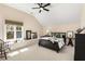 Vaulted ceiling bedroom with a large window, natural light and neutral carpet at 1244 Kingsley Ne Cir, Atlanta, GA 30324