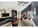 Home office with dark walls, desk, leather chair, and zebra print rug at 1244 Kingsley Ne Cir, Atlanta, GA 30324