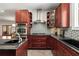 Gourmet kitchen featuring black countertops and stainless steel appliances at 1244 Kingsley Ne Cir, Atlanta, GA 30324