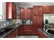 Well-appointed kitchen boasts stainless steel appliances, black countertops, and a tiled backsplash at 1244 Kingsley Ne Cir, Atlanta, GA 30324