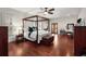 Spacious main bedroom featuring a four-poster bed and hardwood floors at 1244 Kingsley Ne Cir, Atlanta, GA 30324