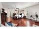 Luxurious main bedroom features a four poster bed and gleaming wood floors at 1244 Kingsley Ne Cir, Atlanta, GA 30324