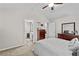 Primary bedroom featuring vaulted ceiling, neutral colors, and adjoined bathroom access at 1325 Richland Creek Ct, Buford, GA 30518