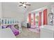 bedroom with bunk beds, pink chairs, vaulted ceilings, and a view of the windows at 1325 Richland Creek Ct, Buford, GA 30518