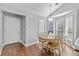 Light-filled dining area features a table with seating for six and lovely windows at 1325 Richland Creek Ct, Buford, GA 30518