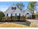 Charming home with light gray siding, dark shutters, well-maintained landscaping and driveway at 1325 Richland Creek Ct, Buford, GA 30518