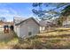 Image displays the rear exterior of a home, showcasing the backyard and deck at 1325 Richland Creek Ct, Buford, GA 30518