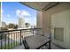 Cozy balcony with city views features a table and chairs, great for outdoor relaxation at 325 E Paces Ferry Ne Rd # 504, Atlanta, GA 30305