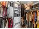 Organized walk-in closet with shelves and hanging racks provides ample storage space at 325 E Paces Ferry Ne Rd # 504, Atlanta, GA 30305