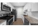Bright kitchen with white cabinets, stainless steel appliances, and stylish countertops at 325 E Paces Ferry Ne Rd # 504, Atlanta, GA 30305