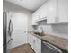 Well-lit kitchen featuring stainless steel appliances, bright countertops, and tiled backsplash at 325 E Paces Ferry Ne Rd # 504, Atlanta, GA 30305