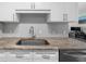 Close up of the sink area in a kitchen with stainless steel sink and neutral color granite counter tops at 325 E Paces Ferry Ne Rd # 504, Atlanta, GA 30305