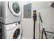 Laundry room with stacked washer and dryer, utility closet and cleaning supplies at 325 E Paces Ferry Ne Rd # 504, Atlanta, GA 30305