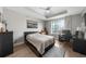 Spacious main bedroom with wood floors, a ceiling fan, and lots of natural light at 325 E Paces Ferry Ne Rd # 504, Atlanta, GA 30305