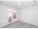 Bright bedroom with a door leading to a balcony and natural light at 338 Olmstead Way # 35, Alpharetta, GA 30022