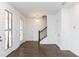 Bright entryway featuring hardwood floors, white walls, a staircase, and natural light at 338 Olmstead Way # 35, Alpharetta, GA 30022