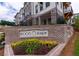 Ecco Park community signage featuring brickwork and manicured landscaping at 338 Olmstead Way # 35, Alpharetta, GA 30022