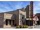 Exterior view of the Eagle theater with a lit-up sign in front of an urban setting at 4375 Easter Lily Ave Lot 81, Buford, GA 30519