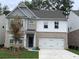 Beautiful brick and siding two-story home with a well-maintained lawn and a two-car garage at 4375 Easter Lily Ave Lot 81, Buford, GA 30519