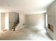 Open concept living room with stairs leading to the second floor and natural light at 4375 Easter Lily Ave Lot 81, Buford, GA 30519