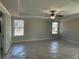 Large primary bedroom with tray ceiling and abundant natural light from the large windows at 4375 Easter Lily Ave Lot 81, Buford, GA 30519