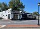 Exterior shot of a 'World Kitchen' restaurant with ample parking, inviting curb appeal at 4375 Easter Lily Ave Lot 81, Buford, GA 30519