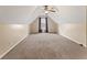 Large bonus room with vaulted ceilings and plush carpeting at 8819 Lakecrest Way, Union City, GA 30291