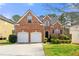 Charming two-story brick home with a well-manicured lawn and a two-car garage at 8819 Lakecrest Way, Union City, GA 30291