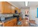 Modern kitchen featuring wood cabinets, stainless steel appliances, and granite countertops at 8819 Lakecrest Way, Union City, GA 30291