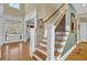 Bright foyer with hardwood floors, staircase with decorative iron spindles, and a front door with sidelights at 1420 Orange Shoals Dr, Canton, GA 30115