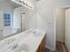 Bright bathroom with double sinks, a large mirror, and a separate tub and shower at 230 Nina Cir, Locust Grove, GA 30248