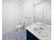 Updated bathroom features decorative floors, modern vanity, and toilet at 230 Nina Cir, Locust Grove, GA 30248