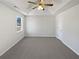 Large bedroom features new carpet, ceiling fan and a view to the outside at 230 Nina Cir, Locust Grove, GA 30248