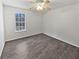 Clean bedroom with a ceiling fan, a window, and wood floors at 230 Nina Cir, Locust Grove, GA 30248