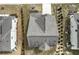 Overhead shot of a gray roof with architectural details, flanked by neighboring homes at 2466 Bear Mountain St, Lithonia, GA 30058