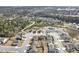 An aerial shot shows homes in a community near a wooded area with a pool and clubhouse at 2466 Bear Mountain St, Lithonia, GA 30058