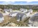 Aerial view of several gray and white homes in a residential neighborhood near wooded area at 2466 Bear Mountain St, Lithonia, GA 30058