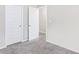 Bedroom with carpet, neutral walls, and white doors at 2466 Bear Mountain St, Lithonia, GA 30058